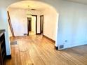 Hardwood floors and arched doorways in the dining room at 2589 N Glencoe St, Denver, CO 80207