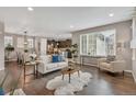 Inviting living room featuring an open floor plan with hardwood floors and lots of natural light at 540 E Fremont Pl, Centennial, CO 80122