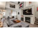 Spacious living room boasting a modern fireplace, vaulted ceilings, and chic decor for comfortable living and entertaining at 3096 W Prentice Ave # G, Littleton, CO 80123