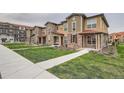 Well-manicured lawns enhance the appeal of these inviting townhomes at 8376 Lorenzo Ln # C, Littleton, CO 80129
