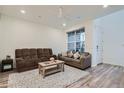 Comfortable living room with neutral tones, plush seating, and natural light at 8376 Lorenzo Ln # C, Littleton, CO 80129