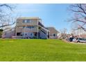 A spacious lawn area slopes gently toward the home, providing ample space for outdoor activities and recreation at 12486 W Nevada Pl # 106, Lakewood, CO 80228