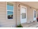 Close-up of the front entrance showcasing the unit number, a white door, and a well-lit exterior at 12486 W Nevada Pl # 106, Lakewood, CO 80228