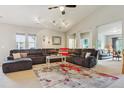 Spacious living room featuring a comfortable sectional sofa, high ceilings, and abundant natural light at 22932 E Ontario Dr # 102, Aurora, CO 80016
