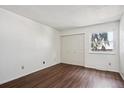 Bright bedroom with hardwood floors and double door closet at 13609 E Yale Ave # A, Aurora, CO 80014