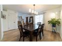 Spacious dining area with hardwood floors and view of stairs at 18360 E Ithaca Pl, Aurora, CO 80013