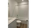 Clean bathroom featuring a shower-tub combo, modern fixtures, and a vanity with a white countertop at 22016 E 39Th Pl, Aurora, CO 80019