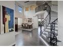 Open dining room features a high ceiling, large windows, and decorative staircase at 10609 Chadsworth Ln, Highlands Ranch, CO 80126