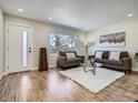 Cozy living room with a large window, plush seating, and stylish decor at 35 Everett St, Lakewood, CO 80226