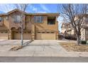 Spacious townhome with a three-car garage, balcony, and a well-kept exterior in a desirable neighborhood at 10127 Bluffmont Ln, Lone Tree, CO 80124