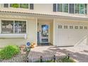 Charming two-story home featuring a brick entryway, a two-car garage and neutral toned siding at 20000 Mitchell Pl # 51, Denver, CO 80249