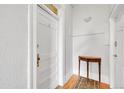 Hallway featuring a white door with number 4 and small table with ornate rug at 54 S Emerson St # 4, Denver, CO 80209