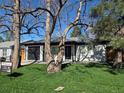 Inviting home featuring a lush green lawn and shade trees at 1130 S Harrison St, Denver, CO 80210