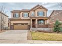 Charming two-story home with a well-maintained front lawn and attached two-car garage at 3522 Harvard Pl, Broomfield, CO 80023