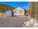 The house includes a detached storage shed and gravel driveway at 445 Beaver Rd # 4, Idaho Springs, CO 80452