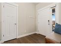 Entryway with hardwood floors, a coat closet and bench at 208 Dorothy Dr, Berthoud, CO 80513