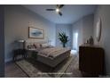 Comfortable bedroom with warm lighting, sleek furniture, and a stylish ceiling fan at 6000 W Floyd Ave # 107, Denver, CO 80227