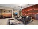 Stylish lounge area featuring a modern wood accent wall, comfortable seating, and contemporary decor at 20 Wilcox St # 302, Castle Rock, CO 80104