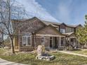 Charming two-story home featuring brick and neutral siding, complemented by a well-maintained lawn and inviting entrance at 6444 Silver Mesa Dr # A, Highlands Ranch, CO 80130
