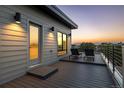Enjoy the scenic sunset views from this outdoor balcony featuring a lounge area at 9052 Harlan St, Westminster, CO 80031