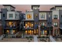 Modern townhome exterior with multiple balconies, showcasing contemporary design and curb appeal at 9052 Harlan St, Westminster, CO 80031