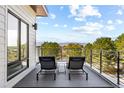 Relax on this rooftop deck with two chairs enjoying the gorgeous mountain views at 9052 Harlan St, Westminster, CO 80031