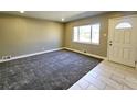 Inviting living room with plush carpet and ample natural light at 6717 Lee St, Arvada, CO 80004