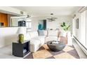 Stylish living room with modern decor, a comfortable sectional sofa, and a textured rug at 1200 N Humboldt St # 1204, Denver, CO 80218