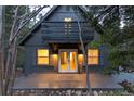 Inviting front view of home featuring a charming porch and well-lit entrance at 236 Harris Dr, Idaho Springs, CO 80452