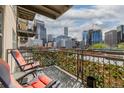 Balcony with chairs offering panoramic city views of the Denver skyline at 1975 N Grant St # 509, Denver, CO 80203