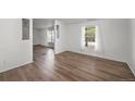 Cozy living room featuring new floors and an abundance of natural light at 5325 Allison St, Arvada, CO 80002