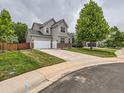 Beautiful home featuring a large driveway, well-maintained lawn, and inviting curb appeal at 8010 Raspberry Dr, Frederick, CO 80504