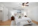 Cozy bedroom with a ceiling fan, a comfortable bed, and bedside lamps at 3981 S Boston St, Denver, CO 80237