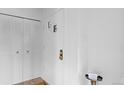 Bright entryway featuring a clean white door and built-in storage on the left at 3981 S Boston St, Denver, CO 80237
