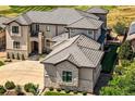 An aerial view displays the roof and backyard, complete with a putting green at 8017 S Valleyhead Way, Aurora, CO 80016