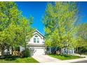 Attractive two-story home with a two-car garage, set back from the street, surrounded by mature trees at 11335 Haswell Dr, Parker, CO 80134