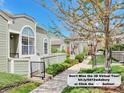 Exterior street view of the townhome featuring well-kept landscaping, walkway, and architectural details at 5872 W Asbury Pl, Lakewood, CO 80227