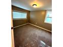 An inviting bedroom featuring neutral walls, carpet, and windows allowing natural light at 1364 Iola St, Aurora, CO 80010