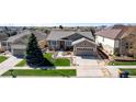 Beautiful home with an attached garage, manicured lawn, and lovely curb appeal at 23644 E Phillips Pl, Aurora, CO 80016
