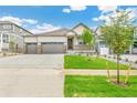 Charming single-Gathering home featuring a covered porch and a spacious three-car garage at 13497 Valentia St, Thornton, CO 80602