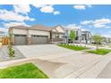 Beautiful single-Gathering home featuring a spacious three-car garage at 13497 Valentia St, Thornton, CO 80602