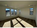 Large bedroom with carpeted floor and expansive windows showcasing mountain views at 3104 S Russell St, Morrison, CO 80465