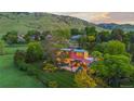 Beautiful aerial view of a modern home featuring unique architecture and stunning landscape design at 700 Utica Ave, Boulder, CO 80304