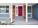 Covered entry and a glimpse of the red front door at 5395 S Flanders Way, Centennial, CO 80015