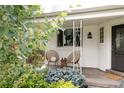 Inviting front porch with seating and decorative plants at 1185 S Steele St, Denver, CO 80210