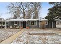 Charming single-story home with a well-maintained front yard and walkway at 701 S Roosevelt Ave, Lafayette, CO 80026