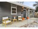 Inviting front porch with chairs, creating a welcoming entrance to the home at 701 S Roosevelt Ave, Lafayette, CO 80026