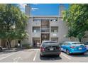 Apartment complex featuring a light gray color scheme and convenient parking at 3600 S Pierce St # 2-201, Lakewood, CO 80235