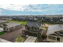 Aerial view of home showing the neighborhood with a field and playground nearby at 2303 Monte Vista St, Fort Lupton, CO 80621