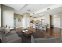 Bright living room with hardwood floors and an open floor plan to the kitchen at 1950 N Logan St # 1109, Denver, CO 80203